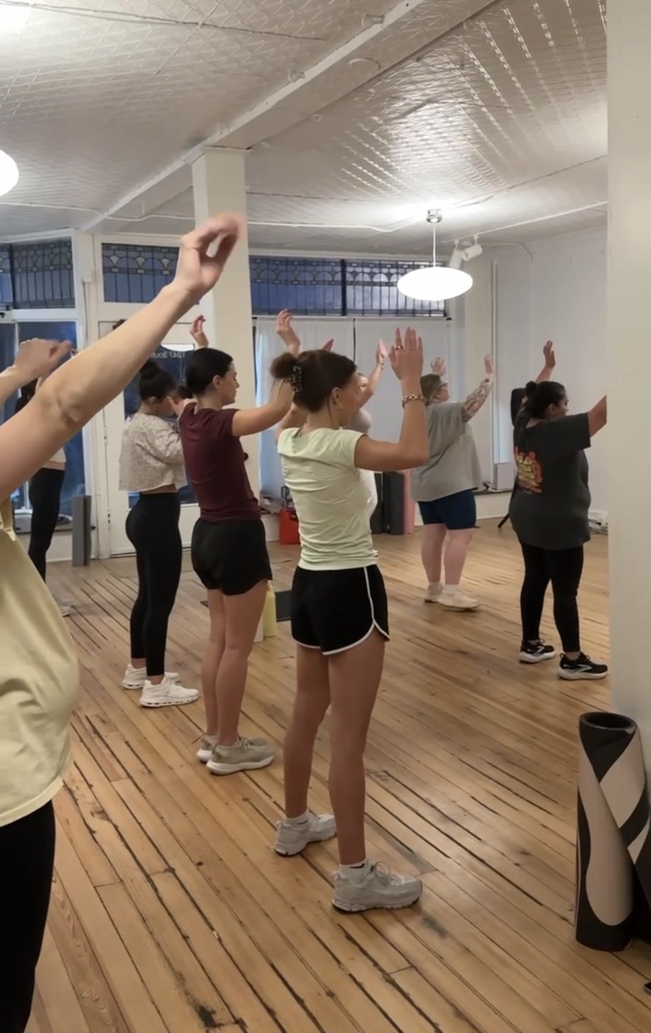 Women worshipping and moving together at Dwell Studio